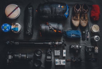 Picture of a variety of camera lenses atop mat