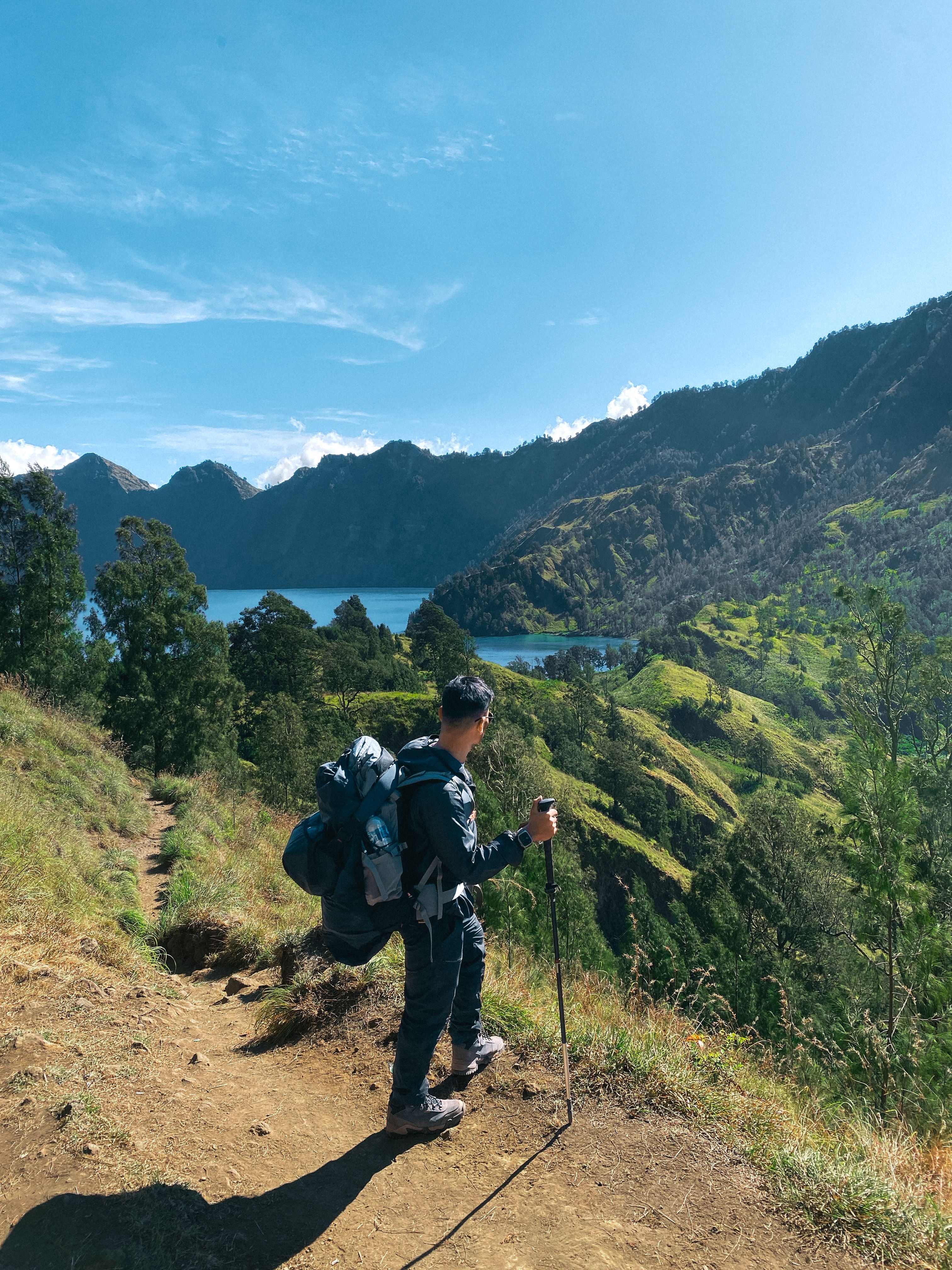 A hiker carrying a weather-resistant trekking backpack.