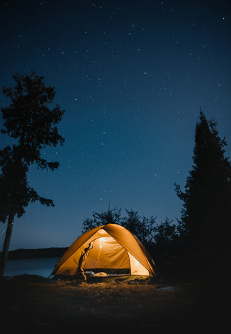 A camping tent at night