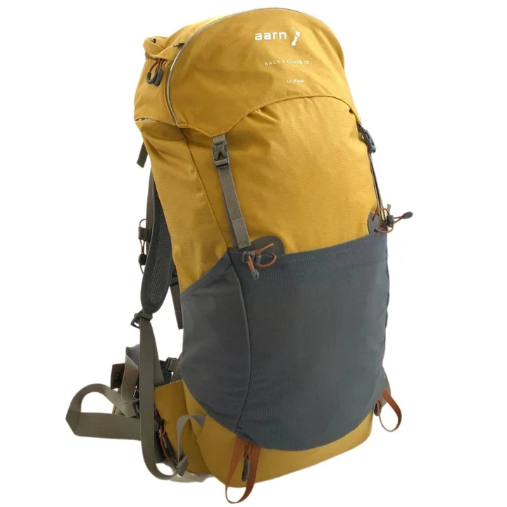 A picture shows a yellow and gray 28 Liter Aarn Back Favour Backpack.