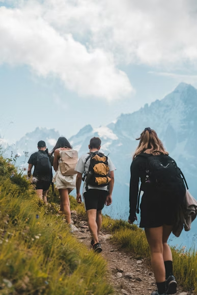 people walking up a trail