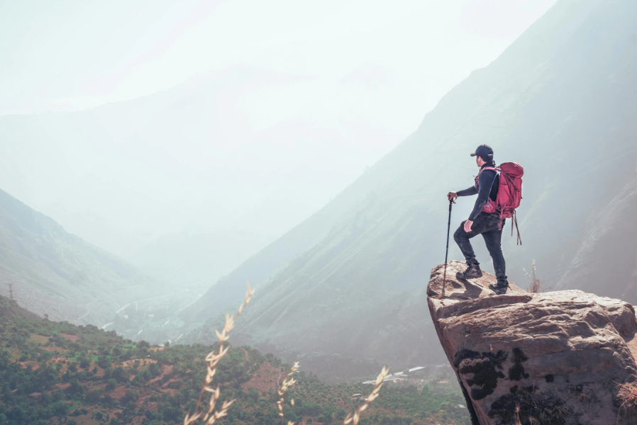 A hiker with a lightweight alpine climbing backpack.