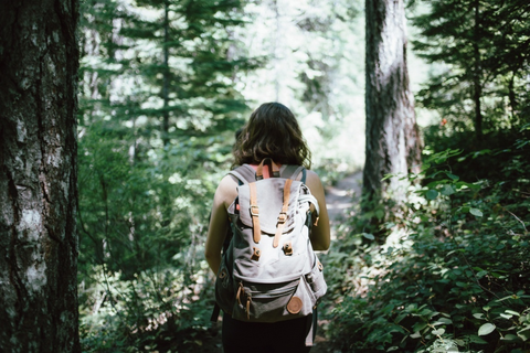 A hiker carrying a lightweight backpack