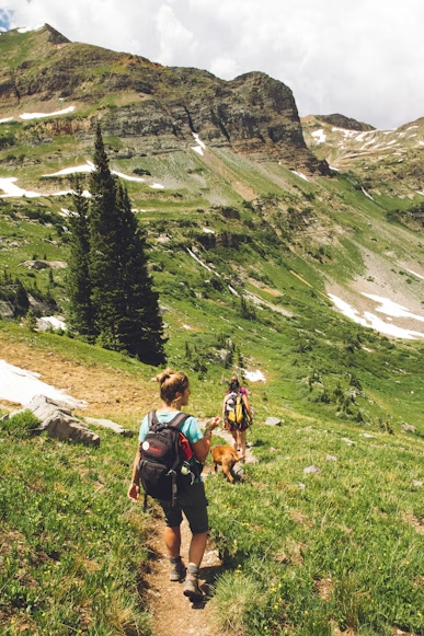 a woman walking down a trail
