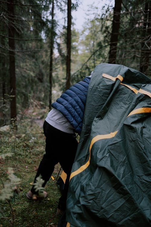 a man coming out of a tent