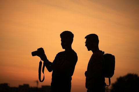 Two friends capturing photos