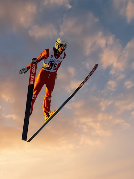 a man airborne while skiing