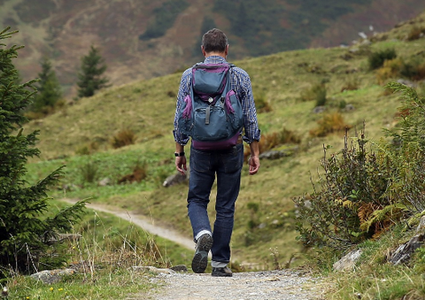 A man trekking outdoors