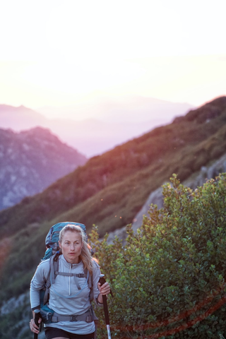  Person carrying an ultralight pack on a hike