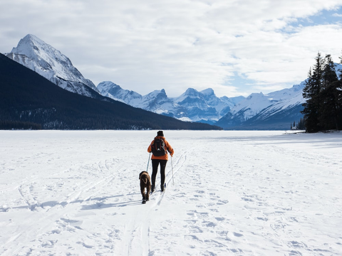 A hiker walking on the snow