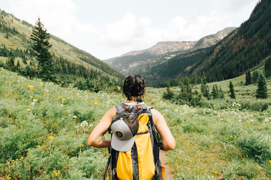 a woman with a yellow backpack